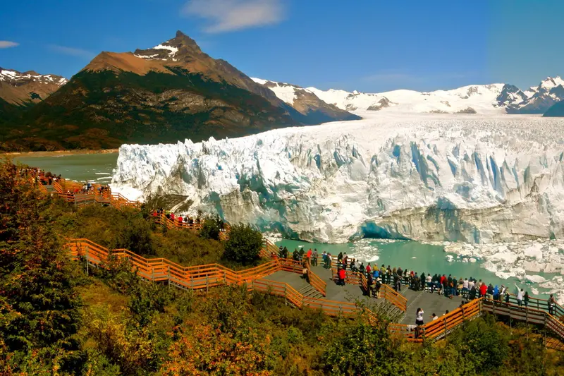 The glacier front seen from the walkways, with visitors along them