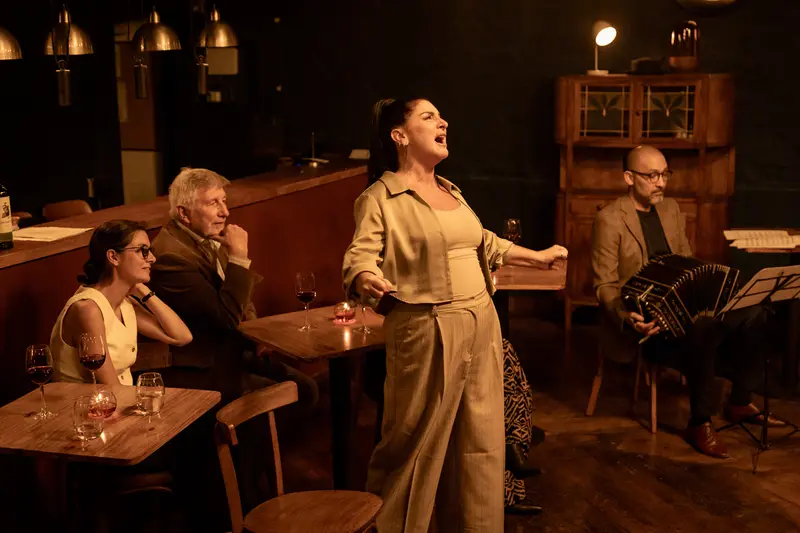 A tango singer performing in a small venue