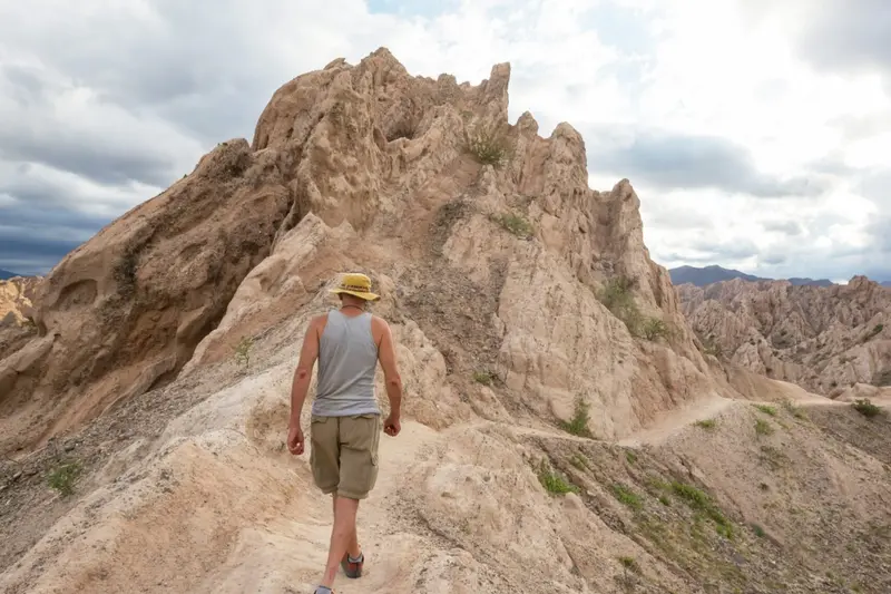 A walker on a ridge of eroded rock