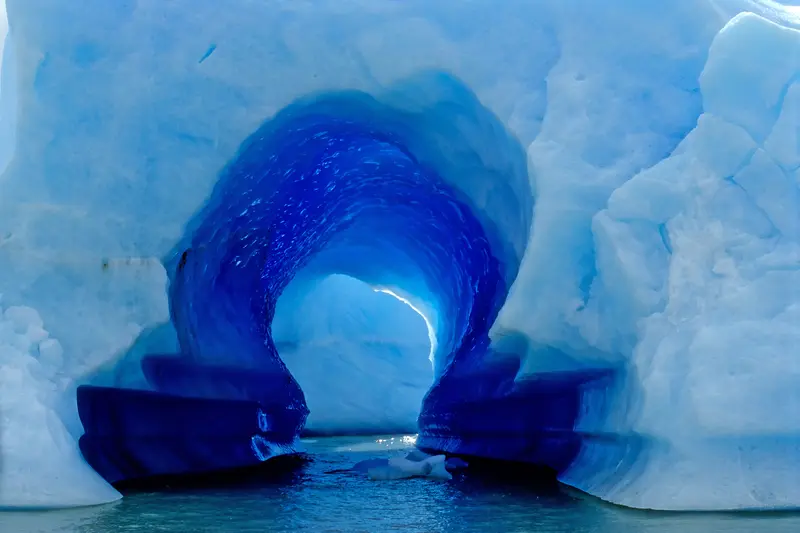 A deep blue ice cave inside the glacier