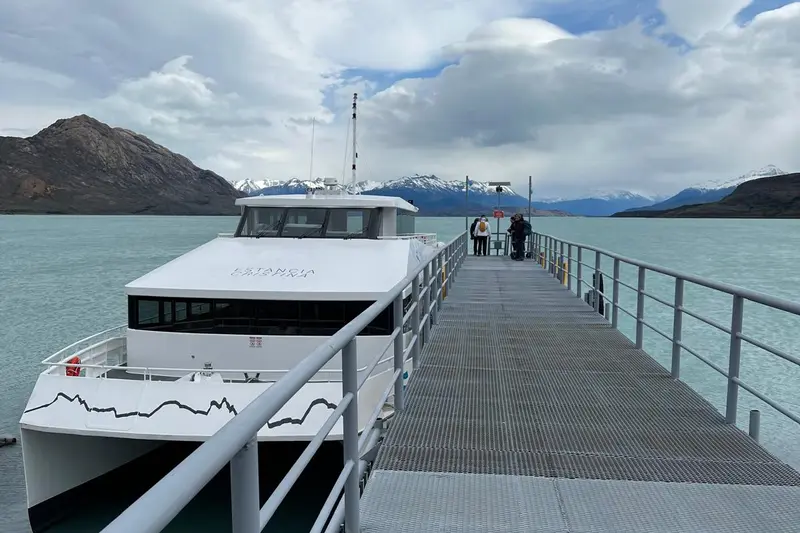 A catamaran alongside the jetty on the lake