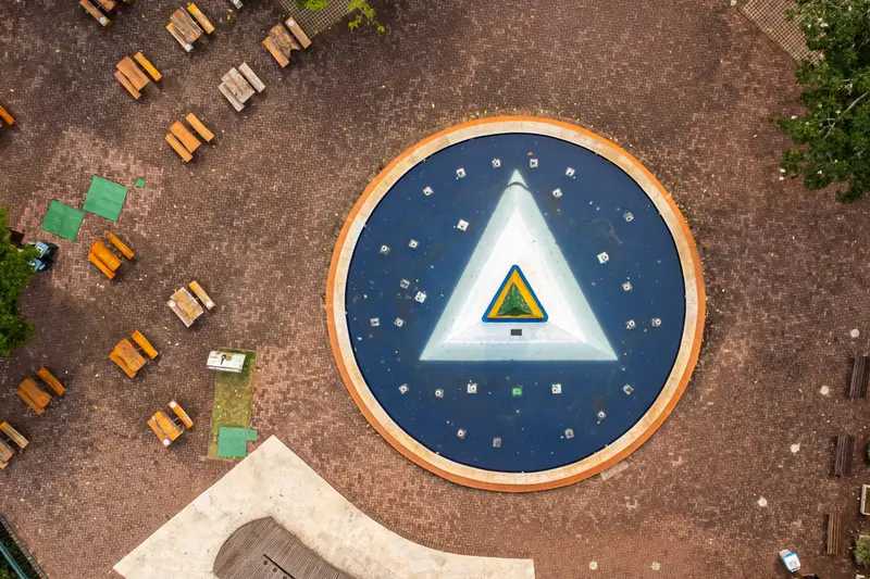 The Three Borders Landmark from above, with benches around the obelisk