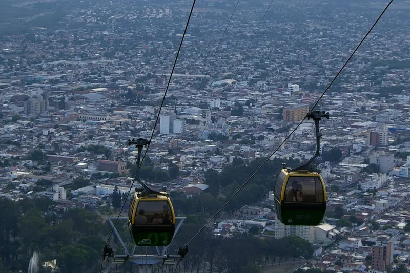 Cable cars crossing above the city of Salta