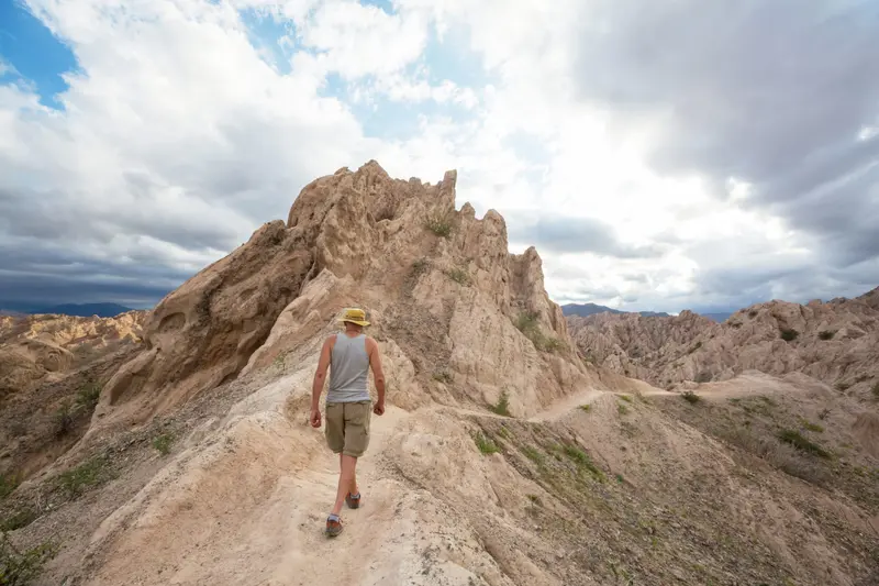 A walker on a ridge of eroded rock