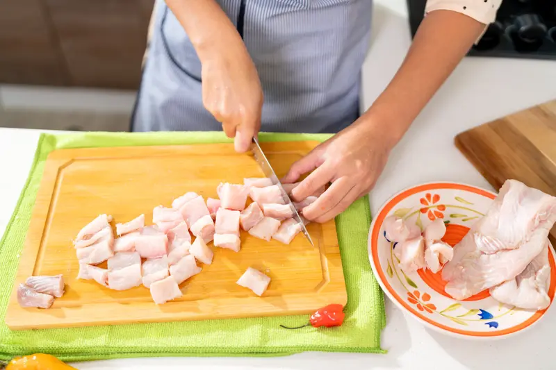 Chef dicing fish for ceviche