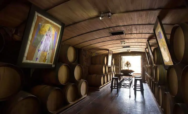 A barrel cellar with a painting at the far end