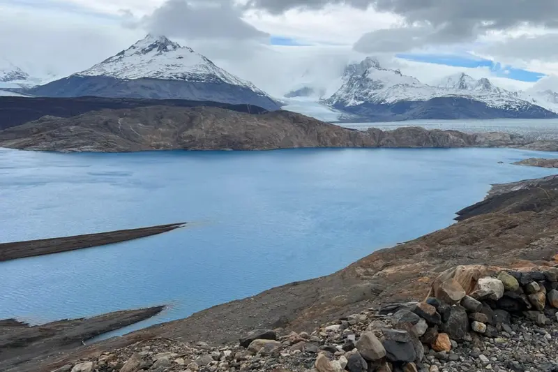 A lake below snow-covered peaks