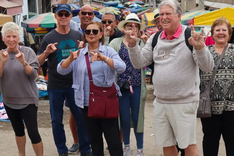 A group walking through a covered market