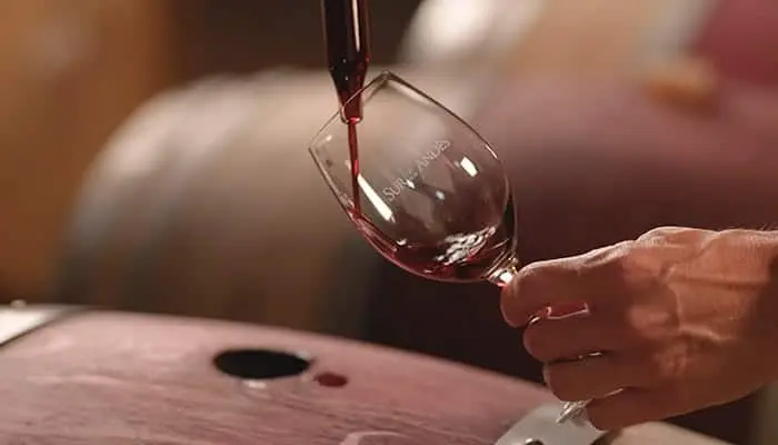 Red wine being poured into a glass