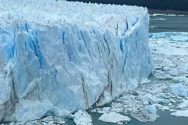 The front wall of the glacier above broken ice