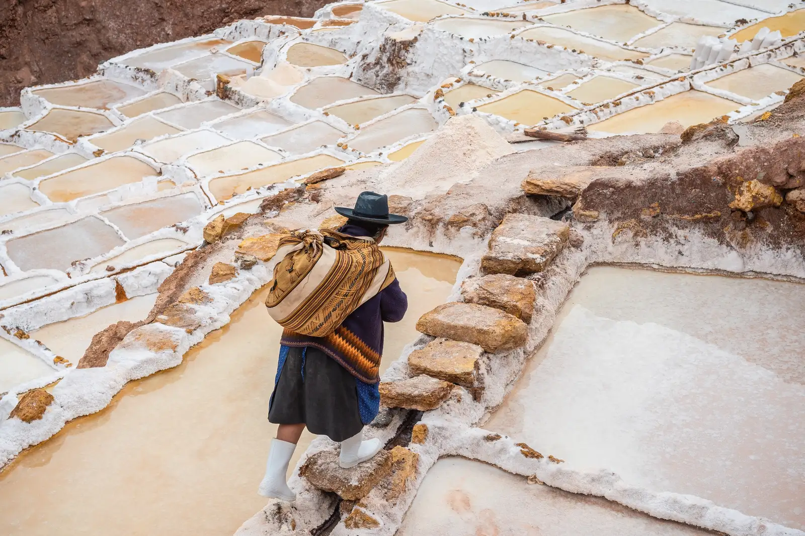 local woman working at the maras salt mine