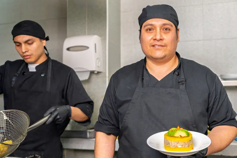 Chef showing their causa