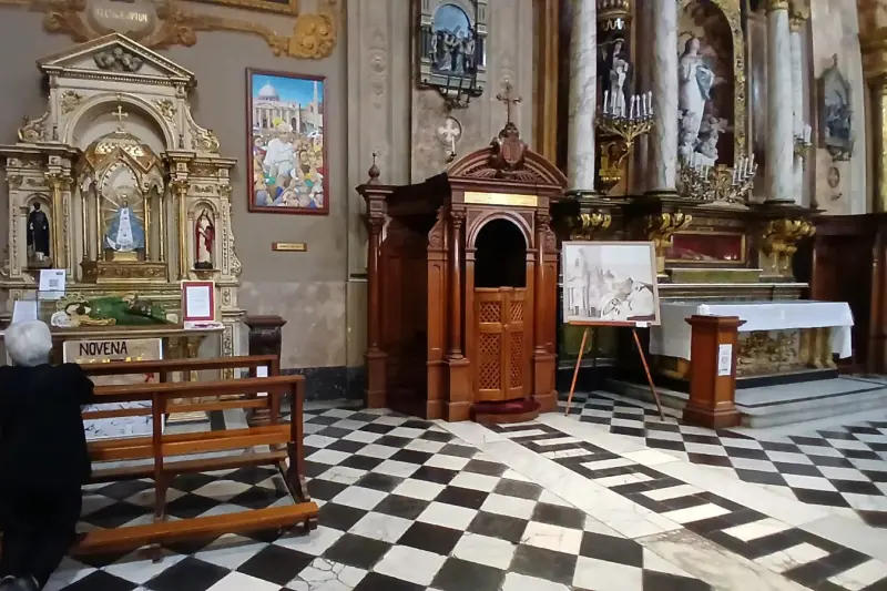 A church interior with a black and white checkerboard floor