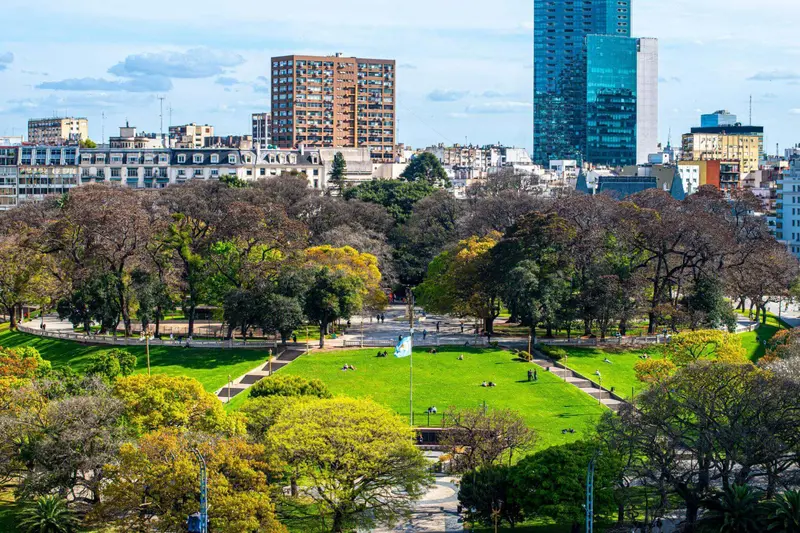 Parkland and lawns with the city behind