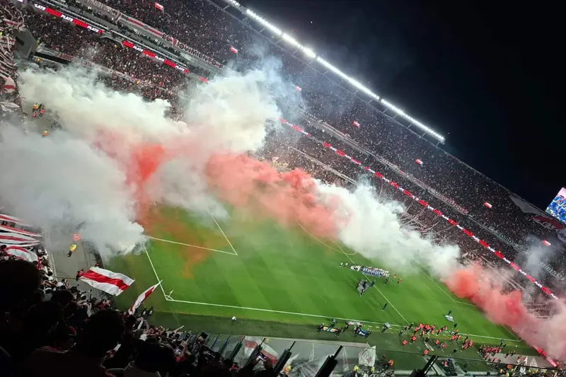 Smoke and flares over the pitch at night