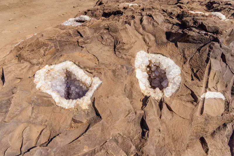 Two amethyst geodes opened in the rock
