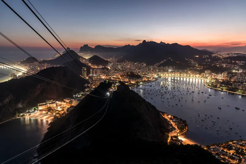 Sugarloaf in silhouette with the city lit up behind it