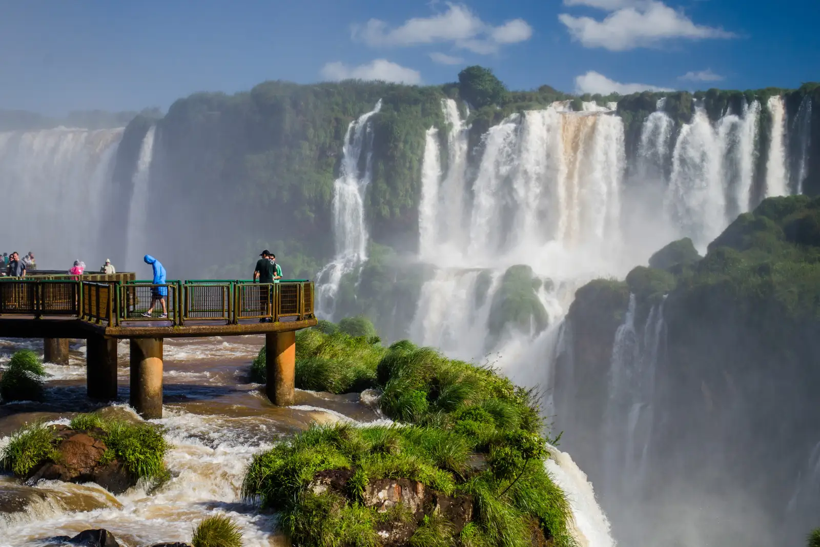 Visitors on the walkway in front of the falls
